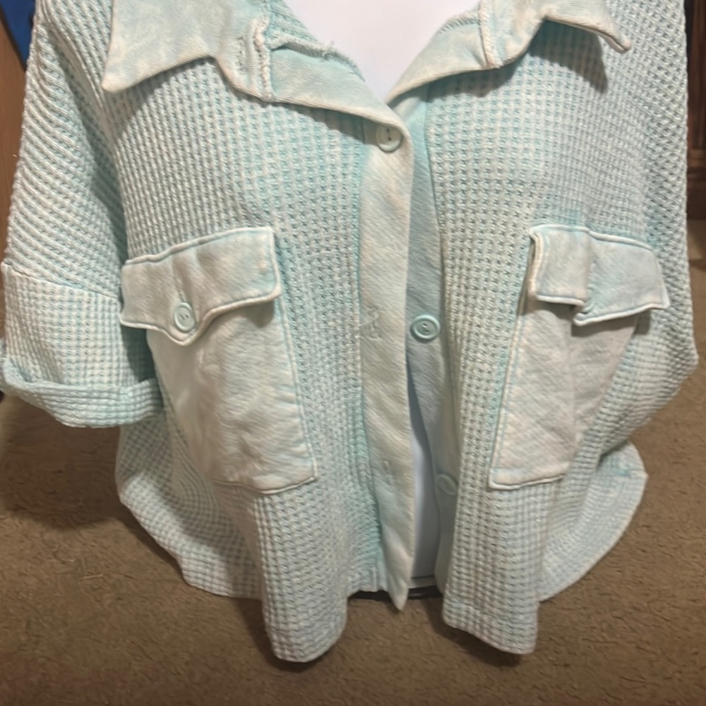 Light blue button up larger shirt